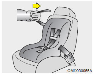 4. Slowly allow the shoulder portion of the seat belt to retract and listen for