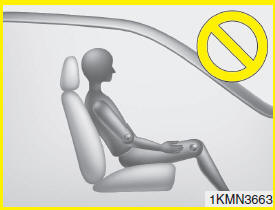 - Never sit with hips shifted towards the front of the seat.