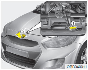 2. Go to the front of the vehicle, raise the hood slightly, pull the secondary