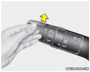 To turn on the high beam headlights, push the lever away from you. Pull it back