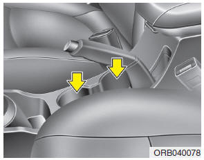 Cups or small beverage cans may be placed in the cup holders.