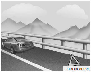 1. Park on a level surface and apply the parking brake firmly.