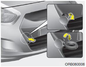 1. Open the trunk lid/tailgate, and remove the towing hook from the tool case.