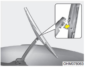 2. Install the new blade assembly by inserting the center part into the slot